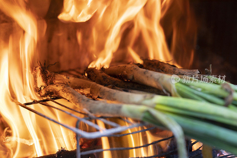 long onions being roasted in chimney,  Catalonian tradition - Calçots